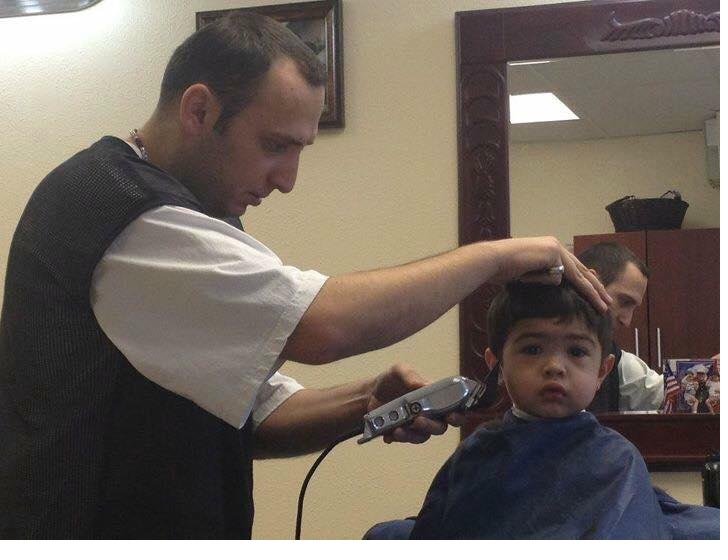Boris cutting a young client's hair