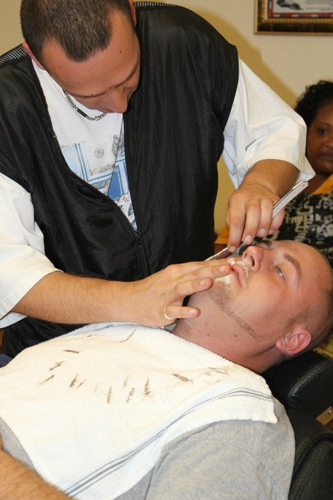 Master barber Boris Mataev giving a precision haircut in Aurora CO