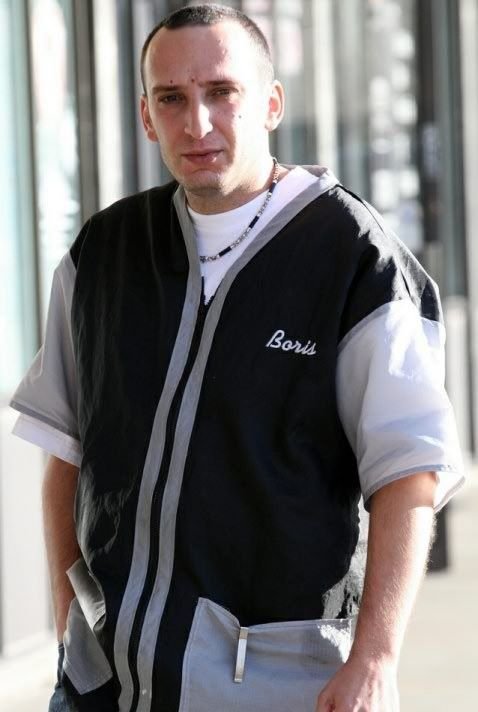 Boris Mataev giving a precision haircut